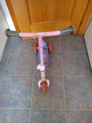 Moto correpasillos rosa y blanca