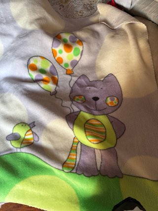 Manta de cuna con gatito y pájaro