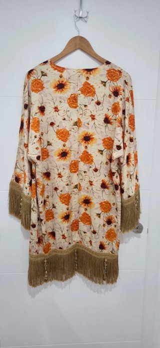 Chaquetilla fina floral con flecos
