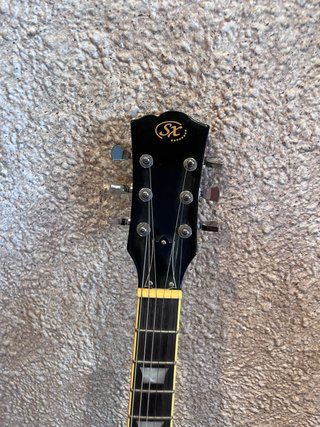 Guitarra SX Negra + Bolsa + Amplificador Fender