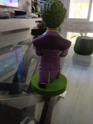 Figura Joker con base y regalo
