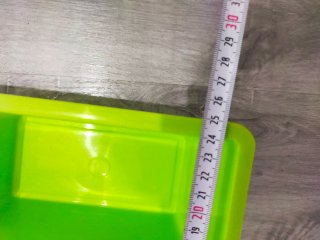 Organizador de plástico verde con asa