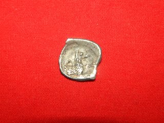 Impresionante Obolo de plata Griego 0,5 gramos