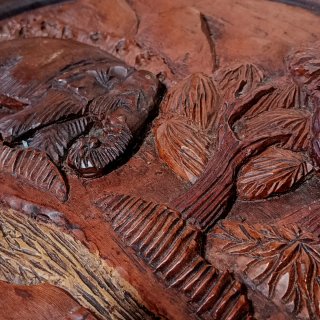 Talla de madera elefante y paisaje