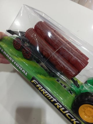 Trattore giocattolo con rimorchio e tronchi