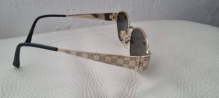 Gafas de sol Gucci doradas y verdes