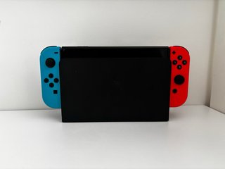 Nintendo Switch OLED entera +3 juegos