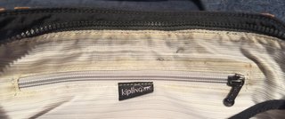 Bolso Kipling floral negro y naranja