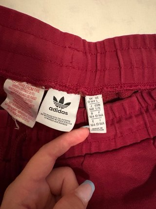 Tuta Adidas rossa con banda laterale