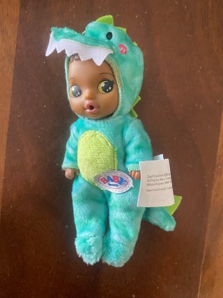 Muñeca Baby Born Dinosaurio