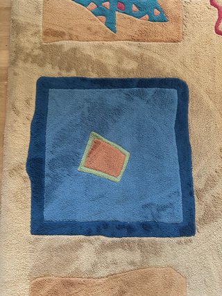 Alfombra de diseño beige y azul