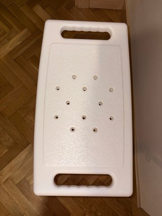 Taburete de ducha plateado y blanco