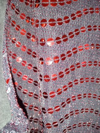 Blusa con lentejuelas rojas y cremallera