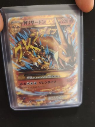 Carta Pokémon M Charizard EX 220 HP first edition