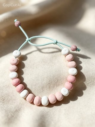 Pulsera perlas blancas y rosas con charm estrella.