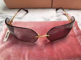 Gafas de sol Miu Miu doradas