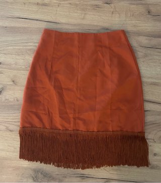 Falda naranja con flecos talla XS