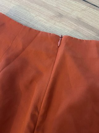 Falda naranja con flecos talla XS