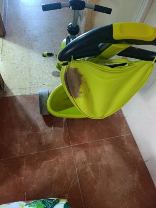 Triciclo infantil verde con capota