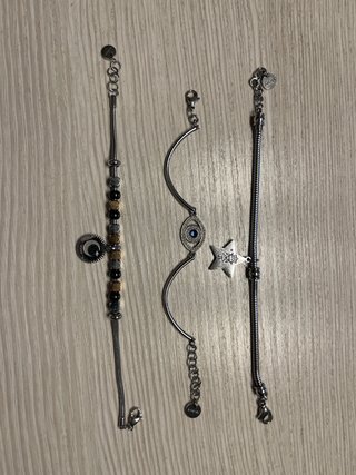 Tre bracciali argento con ciondoli