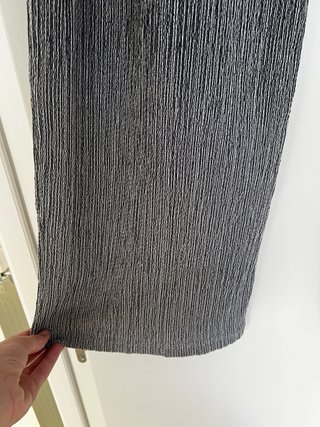 Pantalones grises plisados