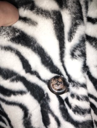 Abrigo pelo estampado cebra