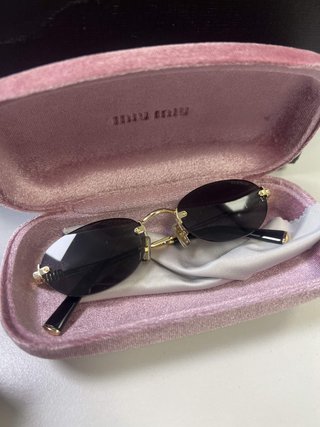 Gafas Miu Miu Ovaladas Sin Montura Doradas