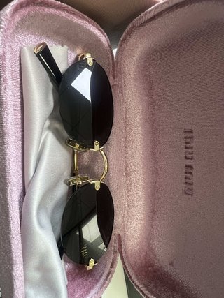 Gafas Miu Miu Ovaladas Sin Montura Doradas