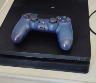 PS4 Slim 500 GB + Mando Sonic y juegos como FC 26