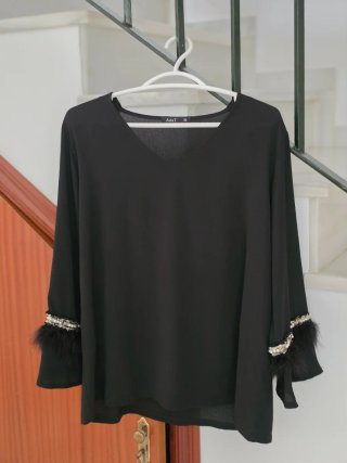 Top fino y elegante de señora