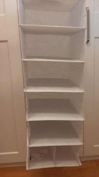 Almacenador de tela colgante