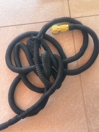 Manguera extensible rota, cabezal funcional