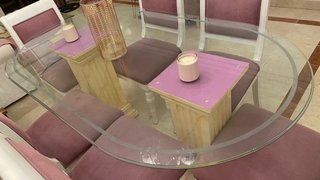Mesa de comedor de cristal ovalada