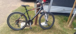Bicicleta Orbea MTB Negra y Naranja en sanguli