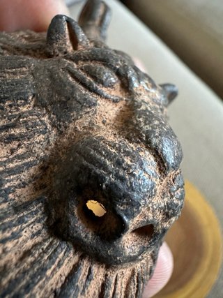 Cabeza de león bronce arte africano