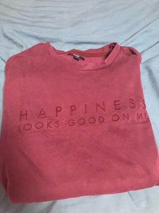 Sudadera KIABI roja con mensaje
