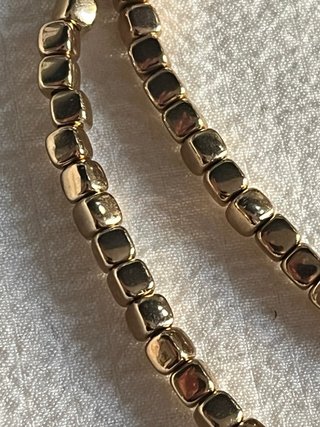 Collana elastica perline quadrate oro