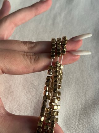 Collana elastica perline quadrate oro
