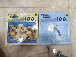 2 Puzles 100 piezas cachorros y delfín.