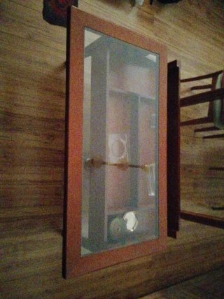Mesa de centro de cristal y madera elevable