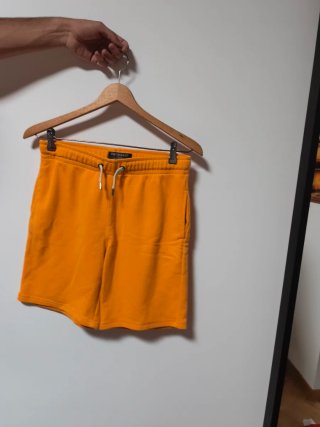 Pantalón corto deportivo naranja hombre