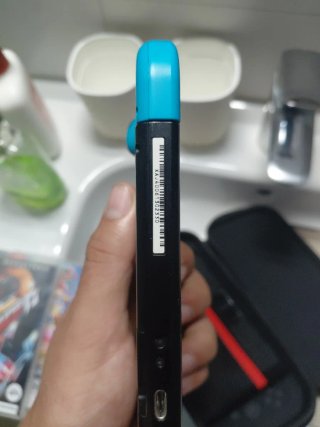 Nintendo Switch + Funda Mario + Accesorios