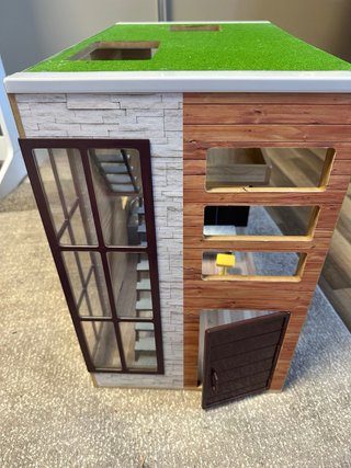 Casa de muñecas de madera con muebles