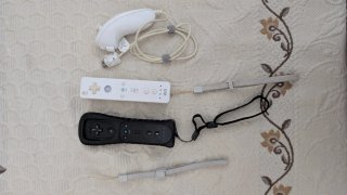 Nintendo Wii con 2 mandos y 4 juegos