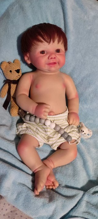 Tierno reborn silicona niño  con pelo caoba
