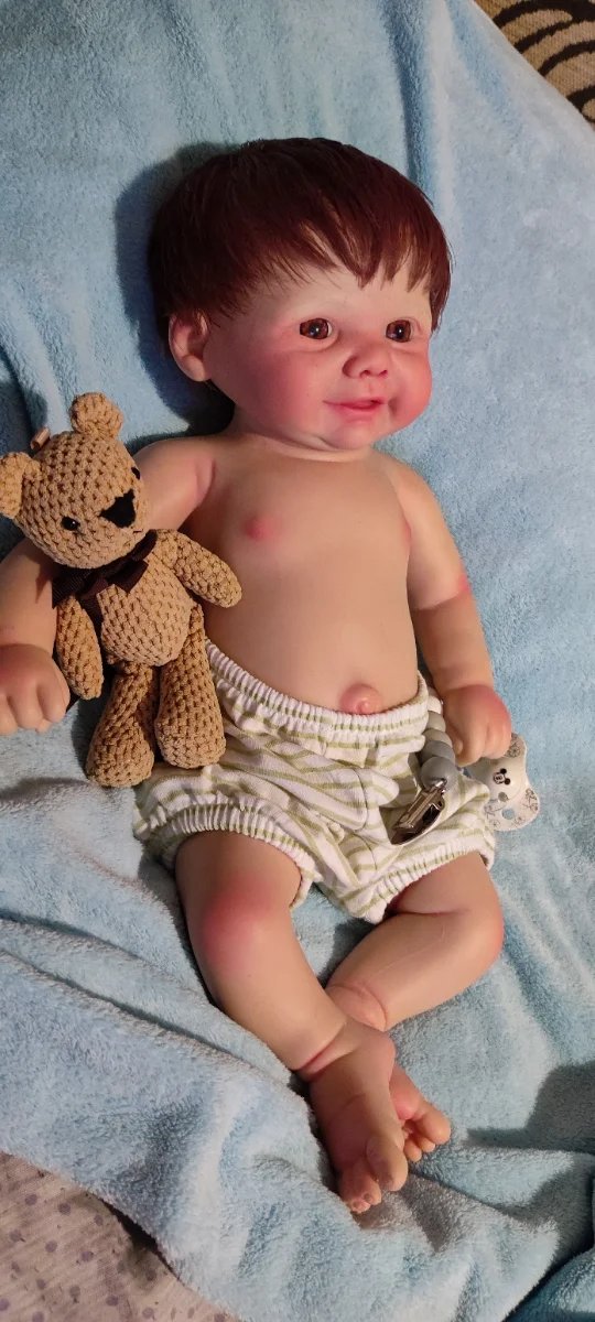 Tierno reborn silicona niño  con pelo caoba