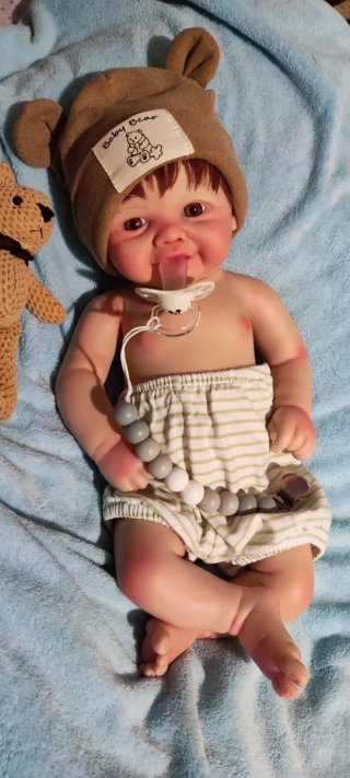 Tierno reborn silicona niño  con pelo caoba
