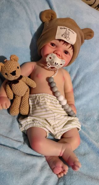Tierno reborn silicona niño  con pelo caoba