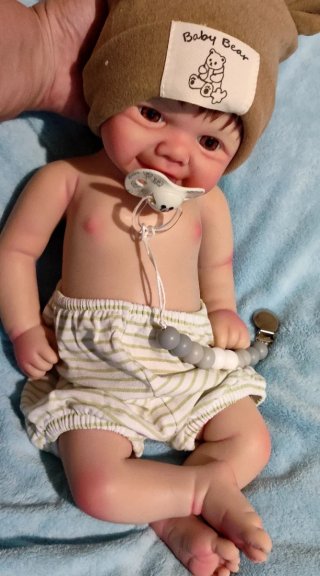 Tierno reborn silicona niño  con pelo caoba