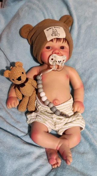 Tierno reborn silicona niño  con pelo caoba